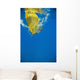 Underwater View Of Yellow Paddle Stroking Water, Creating Bubbles Wall Mural
