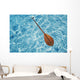 Overhead View Of Paddle Floating On Surface Of Turquoise Water Wall Mural