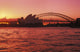 Australia, New South Wales, Opera House and Harbor Bridge at sunset Wall Mural