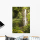 USA, Hawaii, Maui, Kipahulu, Wailua Falls surrounded by foliage Wall Mural