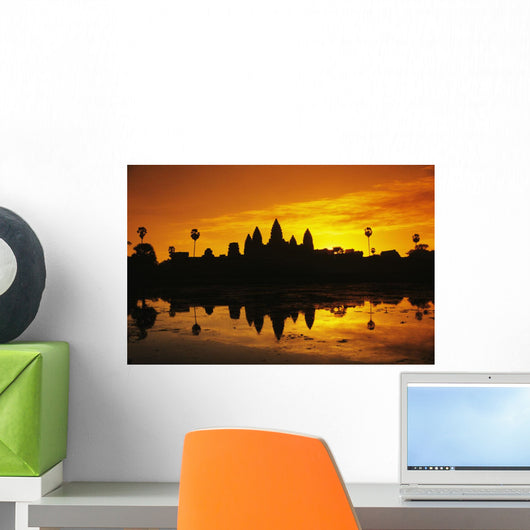 Silhouette of temple against orange sky during sunrise Wall Mural