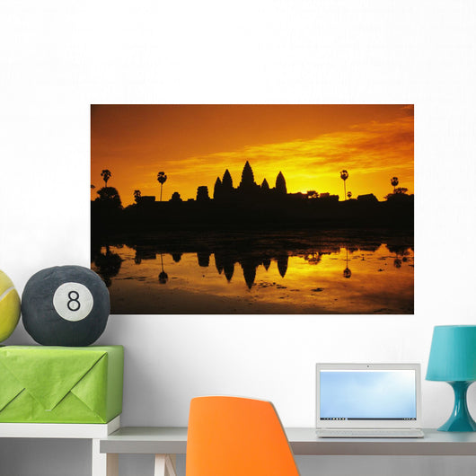 Silhouette of temple against orange sky during sunrise Wall Mural