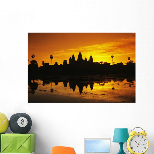 Silhouette of temple against orange sky during sunrise Wall Mural