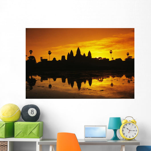 Silhouette of temple against orange sky during sunrise Wall Mural