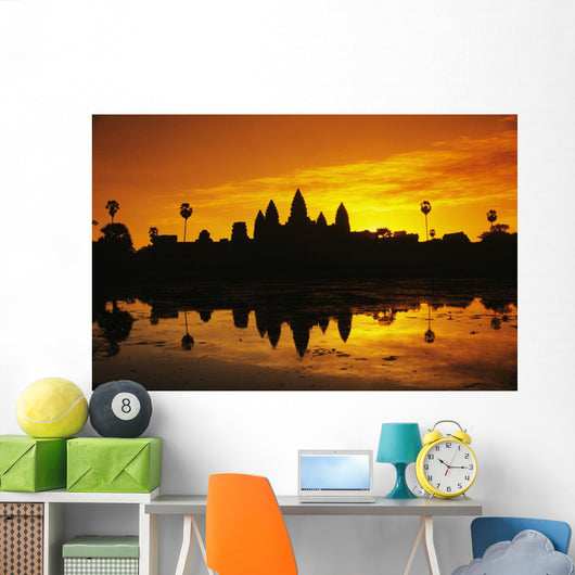 Silhouette of temple against orange sky during sunrise Wall Mural