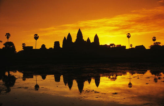 Silhouette of temple against orange sky during sunrise Wall Mural