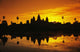 Silhouette of temple against orange sky during sunrise Wall Mural