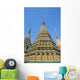 Thailand, Bangkok, Colorful Pointed Steeples Against Clear Blue Sky Wall Mural
