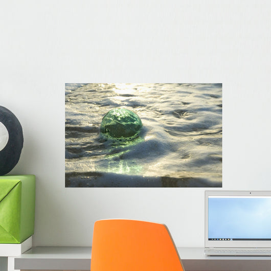 A Glass Fishing Ball Floats In Shallow Water, Bright Reflections Wall Mural