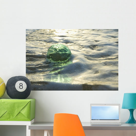 A Glass Fishing Ball Floats In Shallow Water, Bright Reflections Wall Mural