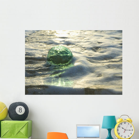 A Glass Fishing Ball Floats In Shallow Water, Bright Reflections Wall Mural