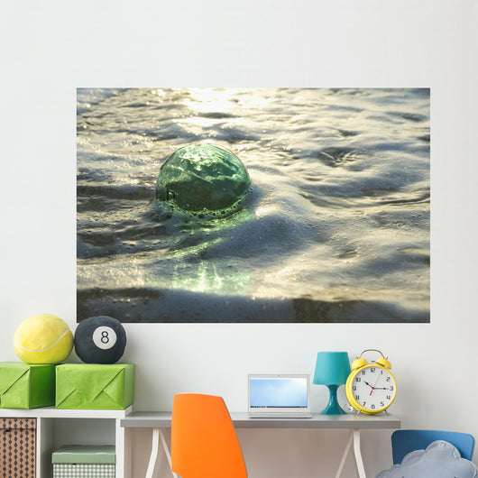 A Glass Fishing Ball Floats In Shallow Water, Bright Reflections Wall Mural