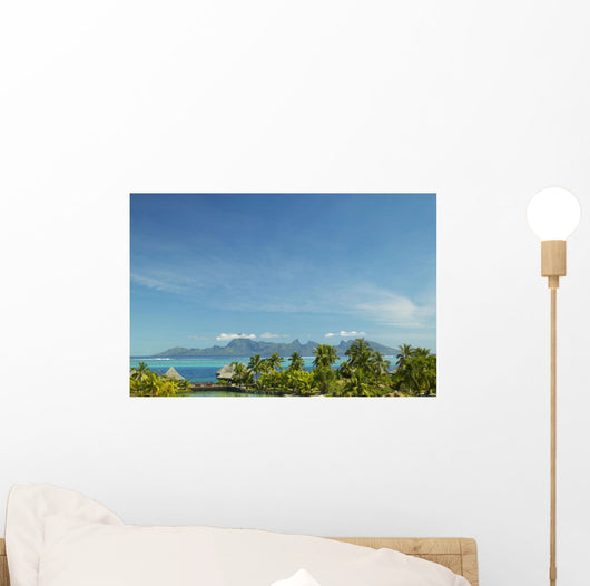 Palm Trees And Grass Huts In Foreground Wall Mural