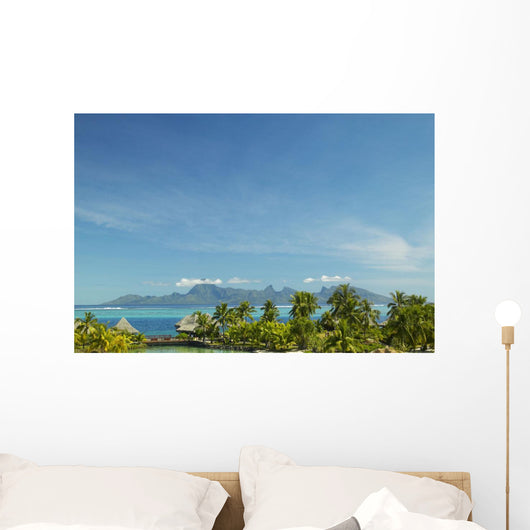 Palm Trees And Grass Huts In Foreground Wall Mural