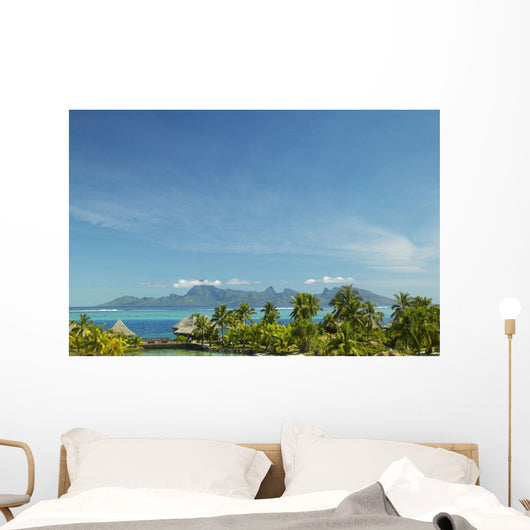 Palm Trees And Grass Huts In Foreground Wall Mural