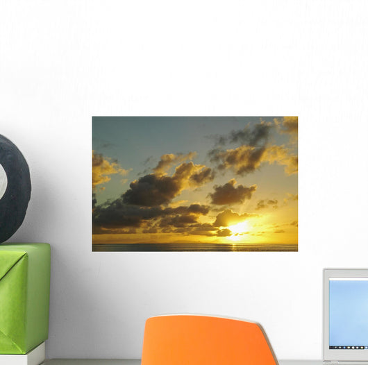 Sun Shining Through Clouds Over The Ocean At Sunset Wall Mural