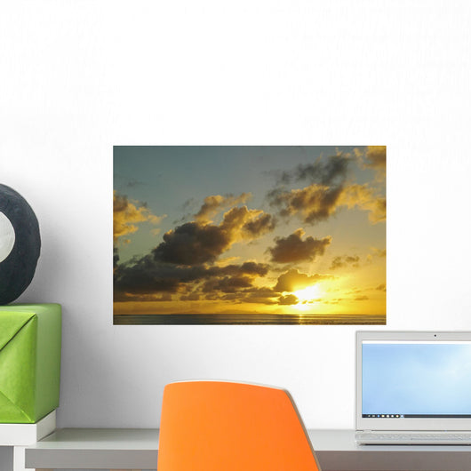 Sun Shining Through Clouds Over The Ocean At Sunset Wall Mural