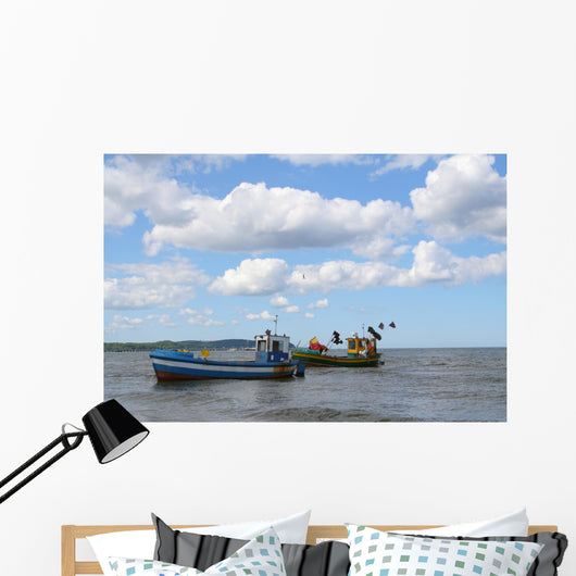 old fishing boats against beautiful sky Wall Mural