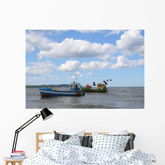 old fishing boats against beautiful sky Wall Mural
