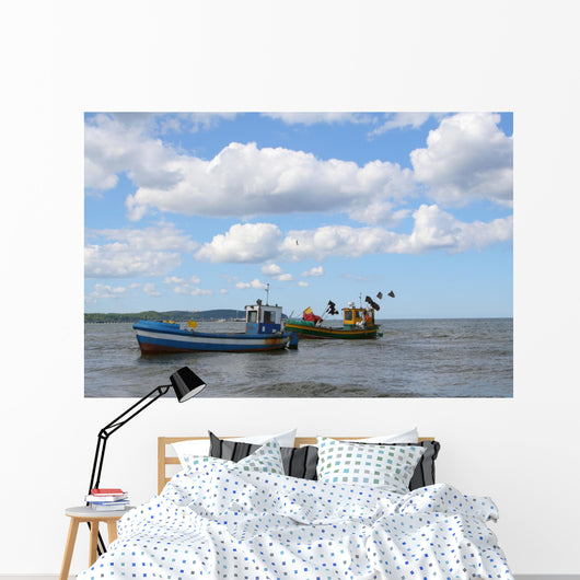 old fishing boats against beautiful sky Wall Mural