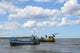 old fishing boats against beautiful sky Wall Mural