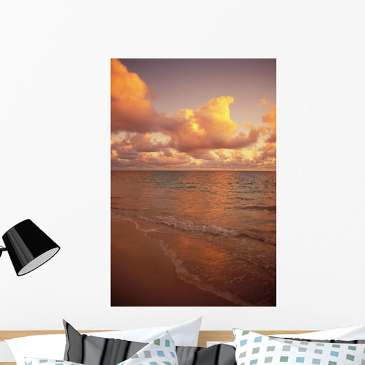 Late Afternoon Light Sreflects Pink Clouds On A Calm Ocean Wall Mural