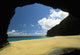 Secluded Beach Seen Through Rock Arch Wall Mural