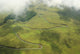 Aerial View Of A Road Winding Up The Crater Wall Mural