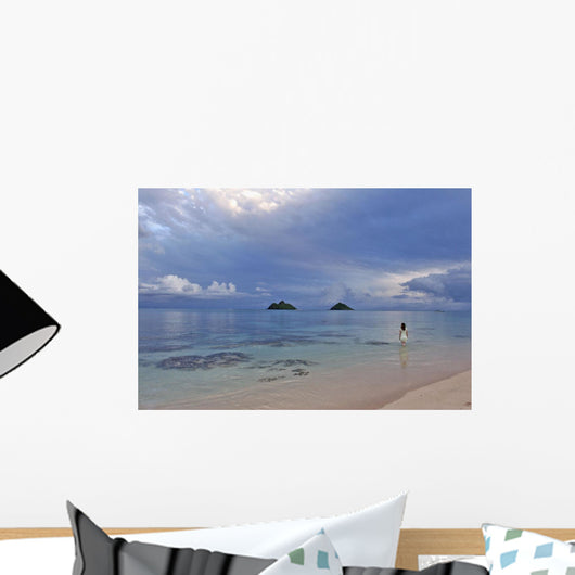 Hawaii, Oahu, Lanikai, A Woman Wades In The Water At The Beach At Dusk Wall Mural