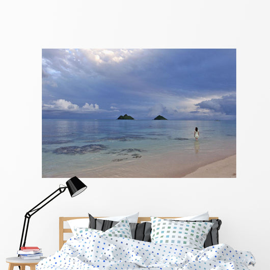 Hawaii, Oahu, Lanikai, A Woman Wades In The Water At The Beach At Dusk Wall Mural