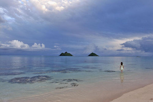 Hawaii, Oahu, Lanikai, A Woman Wades In The Water At The Beach At Dusk Wall Mural