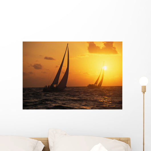Hawaii, Two Sailboats Silhouetted At Sunset, Yellow And Orange Skies Wall Mural