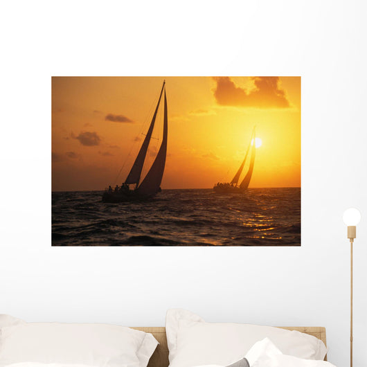Hawaii, Two Sailboats Silhouetted At Sunset, Yellow And Orange Skies Wall Mural