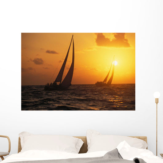 Hawaii, Two Sailboats Silhouetted At Sunset, Yellow And Orange Skies Wall Mural