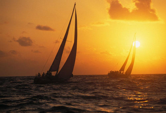 Hawaii, Two Sailboats Silhouetted At Sunset, Yellow And Orange Skies Wall Mural