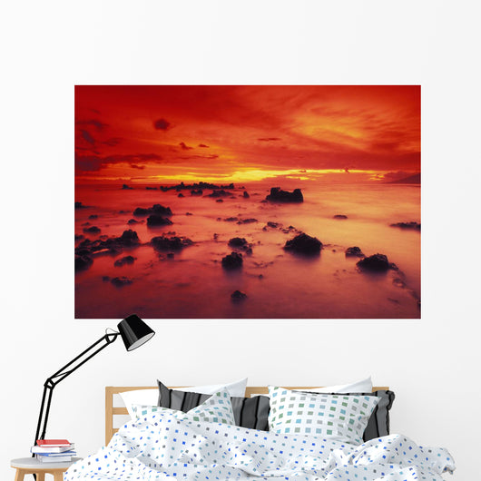 Lava Rock Beach At Sunset With Dramatic Red Yellow Sky And Shore Wall Mural
