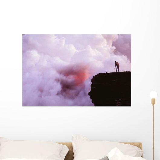 Photographer On Lava Table Filming Lava Flow Into Ocean Wall Mural