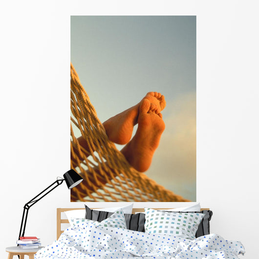 Close-Up Of Bottom Woman's Feet Crossed Wall Mural