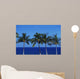 Hawaii, Palm Tree Tops Against Blue Sky And Ocean Wall Mural