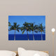 Hawaii, Palm Tree Tops Against Blue Sky And Ocean Wall Mural