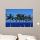 Hawaii, Palm Tree Tops Against Blue Sky And Ocean Wall Mural
