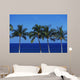 Hawaii, Palm Tree Tops Against Blue Sky And Ocean Wall Mural