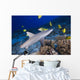 Grey Reef Shark Surrounded By Bright Yellow Fish At The Ocean Floor Wall Mural