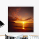 Calm Shoreline Ocean Waters With Orange Reflections From Sunset Wall Mural