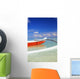 Red And White Outrigger Canoe Floating On Calm Turquoise Water Wall Mural