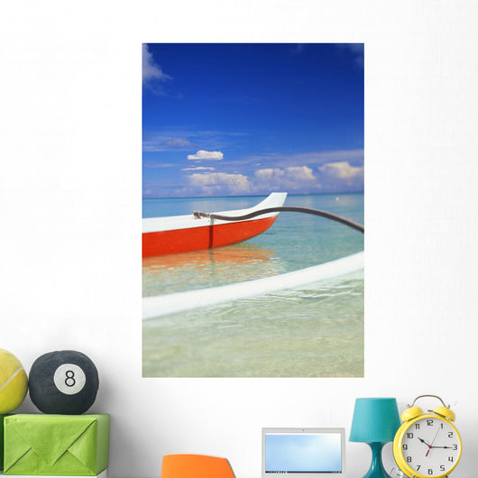 Red And White Outrigger Canoe Floating On Calm Turquoise Water Wall Mural