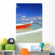 Red And White Outrigger Canoe Floating On Calm Turquoise Water Wall Mural