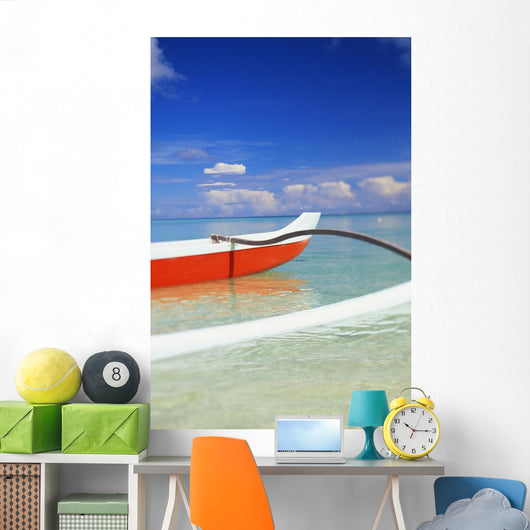Red And White Outrigger Canoe Floating On Calm Turquoise Water Wall Mural