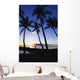 walking along rock wall at sunset Wall Mural
