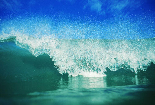 Hawaii, Green Wave Breaking Front View With Blue Skies In Background Wall Mural